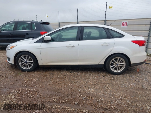 2018 Ford Focus SE z VIN 1FADP3F23JL225333, wystawiony jako IAAI lot #41758445 z przebiegiem 133 307 mil mil oraz . Historia ofert i sprzedaży dostępna na DreamBid. Obrazek 14.