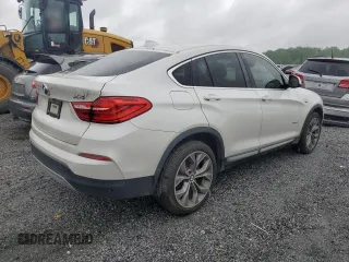 2015 BMW X4 xDrive28i z VIN 5UXXW3C53F0M87109, wystawiony jako Copart lot #54507325 z przebiegiem 115 989 mil mil oraz Tytuł czysty. Historia ofert i sprzedaży dostępna na DreamBid. Obrazek 3.