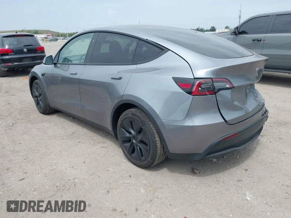 2025 Tesla Model Y Long Range with VIN 7SAYGDED5SF257258, listed as a IAAI auction lot 41877196 with 4,442 mi miles and . Bid and sale history available at DreamBid. Image 3.