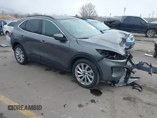 2021 Ford Escape Titanium with VIN 1FMCU9J92MUA27097, listed as a IAAI auction lot 41542774 with 14,822 mi miles and . Bid and sale history available at carsss.com. Image 1.