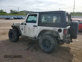 2016 Jeep Wrangler Willys Wheeler z VIN 1C4AJWAG4GL243285, wystawiony jako Copart lot #58035425 z przebiegiem 100 251 mil mil oraz Szkoda całkowita • Salvage title. Historia ofert i sprzedaży dostępna na DreamBid. Obrazek 2.