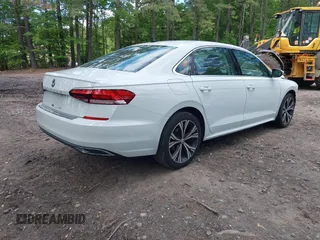 2021 Volkswagen Passat SE with VIN 1VWSA7A38MC014396, listed as a IAAI auction lot 42201818 with 62,193 mi miles and . Bid and sale history available at DreamBid. Image 4.