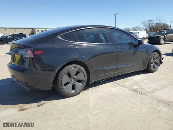 2021 Tesla Model 3 Standard Range Plus with VIN 5YJ3E1EA2MF986029, listed as a Copart auction lot 47848525 with 94,973 mi miles and Salvage Title. Bid and sale history available at carsss.com. Image 3.