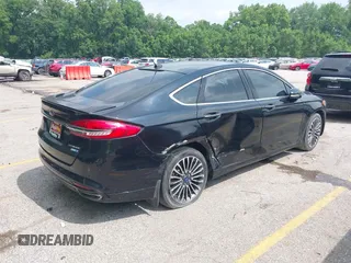 2017 Ford Fusion Titanium with VIN 3FA6P0D92HR252476, listed as a IAAI auction lot 40176942 with 88,818 mi miles and . Bid and sale history available at DreamBid. Image 4.