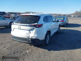 2016 Mazda CX-9 Touring with VIN JM3TCBCY5G0122551, listed as a IAAI auction lot 41613683 with 137,474 mi miles. Bid and sale history available at carsss.com. Image 4.