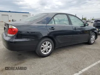 2006 Toyota Camry LE z VIN 4T1BF32K56U621741, wystawiony jako Copart lot #59577595 z przebiegiem 189 155 mil mil oraz Czysty tytuł • Clean title. Historia ofert i sprzedaży dostępna na DreamBid. Obrazek 3.