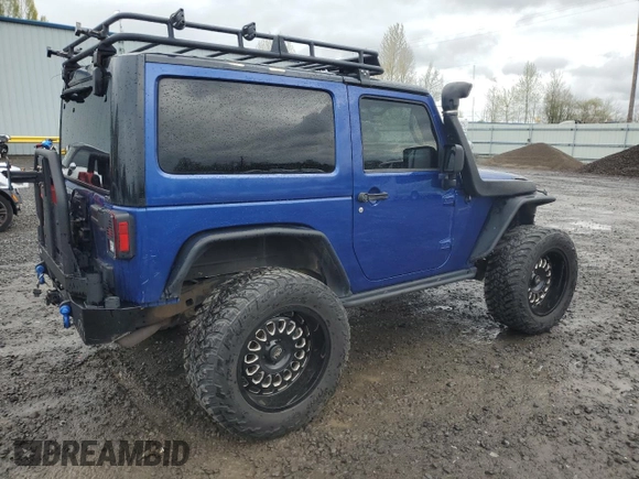 2009 Jeep Wrangler X with VIN 1J4FA24179L700884, listed as a Copart auction lot 52194055 with 96,189 mi miles and Salvage Title. Bid and sale history available at DreamBid. Image 3.