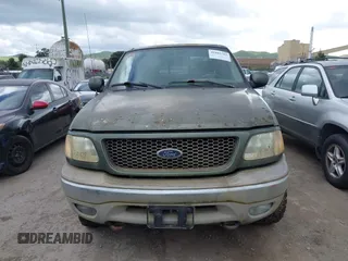 2003 Ford F-150 XLT with VIN 1FTRW08L43KC83824, listed as a IAAI auction lot 41885702 with 242,195 mi miles. Bid and sale history available at carsss.com. Image 12.