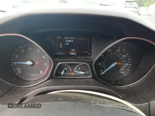 2016 Ford Focus SE z VIN 1FADP3F21GL400767, wystawiony jako Copart lot #52174835 z przebiegiem 141 264 mil mil oraz Szkoda całkowita • Salvage title. Historia ofert i sprzedaży dostępna na DreamBid. Obrazek 9.