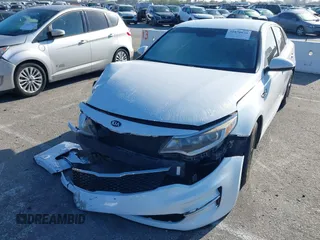 2016 Kia Optima LX with VIN 5XXGT4L33GG014082, listed as a IAAI auction lot 41870030 with 137,849 mi miles and . Bid and sale history available at DreamBid. Image 2.