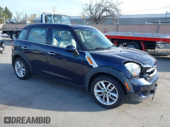 2014 MINI Countryman with VIN WMWZB3C50EWR42268, listed as a IAAI auction lot 41845750 with 117,192 mi miles and . Bid and sale history available at DreamBid. Image 1.