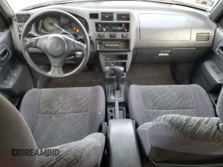 1999 Toyota RAV4 with VIN JT3GP10V9X7042801, listed as a Copart auction lot 82712874 with 256,151 mi miles and Salvage Title. Bid and sale history available at DreamBid. Image 8.