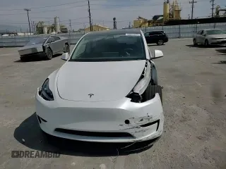 2023 Tesla Model Y Long Range z VIN 7SAYGDEE8PA030286, wystawiony jako Copart lot #50945465 z przebiegiem 43 676 mil mil oraz Szkoda całkowita • Salvage title. Historia ofert i sprzedaży dostępna na DreamBid. Obrazek 12.
