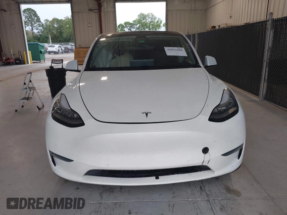 2020 Tesla Model Y Long Range z VIN 5YJYGDEE8LF054338, wystawiony jako IAAI lot #39026888 z przebiegiem 86 142 mil mil oraz . Historia ofert i sprzedaży dostępna na DreamBid. Obrazek 11.