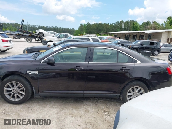 2014 Ford Taurus SE z VIN 1FAHP2D81EG140072, wystawiony jako IAAI lot #42124900 z przebiegiem 116 560 mil mil oraz . Historia ofert i sprzedaży dostępna na DreamBid. Obrazek 14.