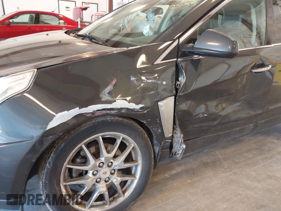 2014 Cadillac SRX Premium Collection z VIN 3GYFNGE38ES606731, wystawiony jako IAAI lot #41844450 z przebiegiem 156 541 mil mil oraz . Historia ofert i sprzedaży dostępna na DreamBid. Obrazek 6.