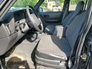 1999 Jeep Cherokee SE with VIN 1J4FF28S0XL541871, listed as a Copart auction lot 59250264 with Not provided miles and Salvage title. Bid and sale history available at DreamBid. Image 7.