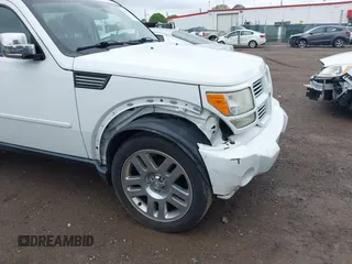 2011 Dodge Nitro Heat z VIN 1D4PU4GK7BW598432, wystawiony jako IAAI lot #42252036 z przebiegiem 148 329 mil mil oraz . Historia ofert i sprzedaży dostępna na DreamBid. Obrazek 6.