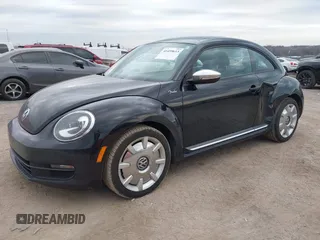 2013 Volkswagen Beetle 2.5L with VIN 3VWJP7AT8DM679548, listed as a IAAI auction lot 41459613 with 135,198 mi miles and . Bid and sale history available at DreamBid. Image 2.