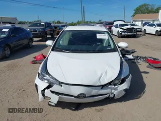 2021 Toyota Prius L Eco with VIN JTDKAMFU2M3147562, listed as a IAAI auction lot 41882066 with 99,491 mi miles. Bid and sale history available at carsss.com. Image 12.