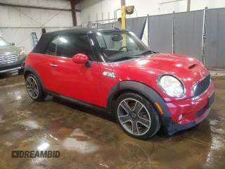 2010 MINI Convertible S with VIN WMWMS3C50ATY51636, listed as a Copart auction lot 66097715 with 103,525 mi miles and Salvage title. Bid and sale history available at DreamBid. Image 4.