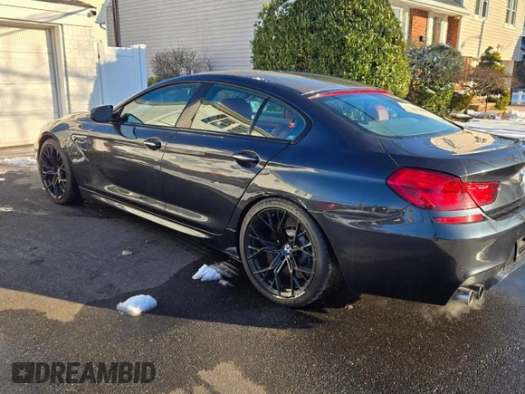 2016 BMW M6 z VIN WBS6E9C57GG437138, wystawiony jako Copart lot #45290525 z przebiegiem 58 645 mil mil oraz Tytuł czysty. Historia ofert i sprzedaży dostępna na DreamBid. Obrazek 3.