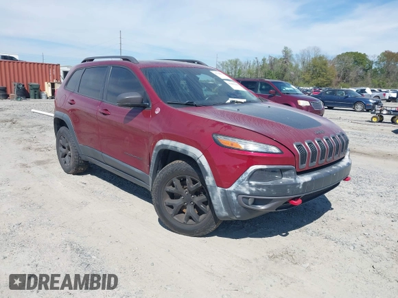 2015 Jeep Cherokee Trailhawk with VIN 1C4PJMBS1FW640483, listed as a IAAI auction lot 41883688 with 103,589 mi miles. Bid and sale history available at carsss.com. Image 1.