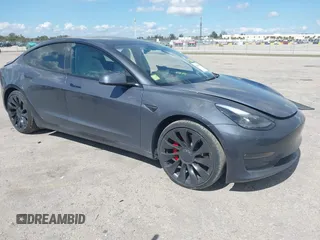 2022 Tesla Model 3 Performance with VIN 5YJ3E1EC9NF201184, listed as a IAAI auction lot 41534959 with 29,389 mi miles and . Bid and sale history available at DreamBid. Image 1.