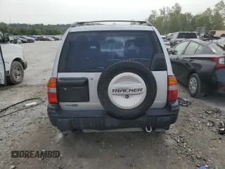 2002 Chevrolet Tracker z VIN 2CNBE13C926934704, wystawiony jako Copart lot #70717194 z przebiegiem 189 076 mil mil oraz Szkody całkowita. Historia ofert i sprzedaży dostępna na DreamBid. Obrazek 6.