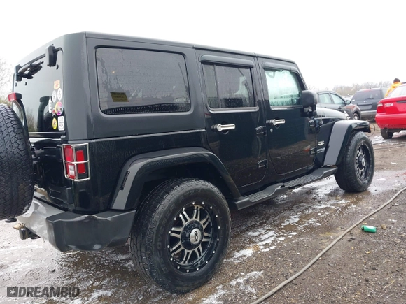 2011 Jeep Wrangler Unlimited Sahara with VIN 1J4BA5H12BL548870, listed as a IAAI auction lot 42010303 with 139,693 mi miles. Bid and sale history available at carsss.com. Image 6.