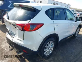 2014 Mazda CX-5 Touring with VIN JM3KE2CY5E0329783, listed as a IAAI auction lot 42017473 with 121,175 mi miles. Bid and sale history available at carsss.com. Image 4.