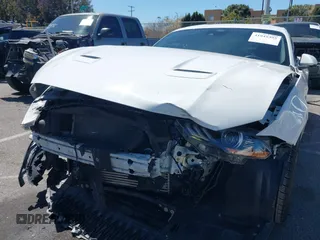 2021 Ford Mustang EcoBoost with VIN 1FA6P8TH4M5148415, listed as a IAAI auction lot 41945395 with 51,599 mi miles and . Bid and sale history available at DreamBid. Image 6.