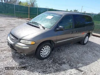 1999 Chrysler Town & Country LXi with VIN 1C4GP54LXXB553393, listed as a IAAI auction lot 41968605 with 256,400 mi miles. Bid and sale history available at carsss.com. Image 2.