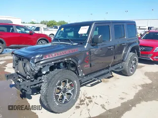 2020 Jeep Wrangler Unlimited Rubicon z VIN 1C4HJXFN0LW300344, wystawiony jako IAAI lot #41943662 z przebiegiem 59 051 mil mil oraz . Historia ofert i sprzedaży dostępna na DreamBid. Obrazek 19.
