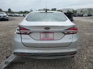 2018 Ford Fusion SE z VIN 3FA6P0H74JR112086, wystawiony jako Copart lot #56630275 z przebiegiem 123 300 mil mil oraz Szkoda całkowita • Salvage title. Historia ofert i sprzedaży dostępna na DreamBid. Obrazek 6.
