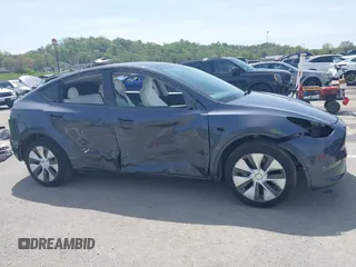 2023 Tesla Model Y Long Range z VIN 7SAYGDEE1PA158661, wystawiony jako IAAI lot #41983897 z przebiegiem 20 176 mil mil oraz . Historia ofert i sprzedaży dostępna na DreamBid. Obrazek 14.