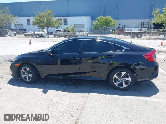 2020 Honda Civic LX with VIN 19XFC2F66LE213975, listed as a IAAI auction lot 42398098 with 69,902 mi miles and . Bid and sale history available at DreamBid. Image 14.