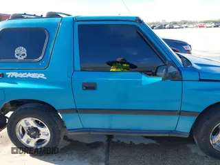 1997 Chevrolet Tracker z VIN 2CNBE1865V6904672, wystawiony jako IAAI lot #41296166 z przebiegiem 266 743 mil mil oraz . Historia ofert i sprzedaży dostępna na DreamBid. Obrazek 13.