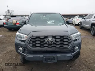 2022 Toyota Tacoma SR with VIN 3TMCZ5AN4NM476170, listed as a IAAI auction lot 41482149 with 57,126 mi miles and . Bid and sale history available at DreamBid. Image 12.
