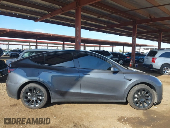 2022 Tesla Model Y Long Range with VIN 7SAYGDEE2NA017434, listed as a IAAI auction lot 41842025 with 35,164 mi miles and . Bid and sale history available at DreamBid. Image 13.