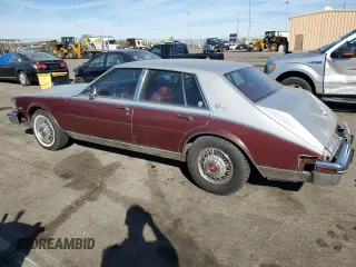 1984 Cadillac Seville z VIN 1G6AS6984EE826325, wystawiony jako Copart lot #77209864 z przebiegiem 26 366 mil mil oraz Tytuł czysty. Historia ofert i sprzedaży dostępna na DreamBid. Obrazek 2.