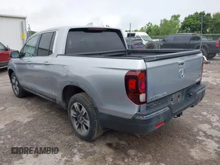 2018 Honda Ridgeline RTL with VIN 5FPYK3F52JB002649, listed as a IAAI auction lot 42338360 with 68,802 mi miles and . Bid and sale history available at DreamBid. Image 3.