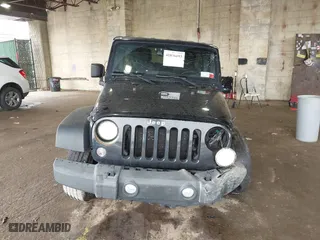 2015 Jeep Wrangler Unlimited Willys Wheeler with VIN 1C4BJWDG9FL652607, listed as a IAAI auction lot 41836193 with 166,152 mi miles. Bid and sale history available at carsss.com. Image 12.