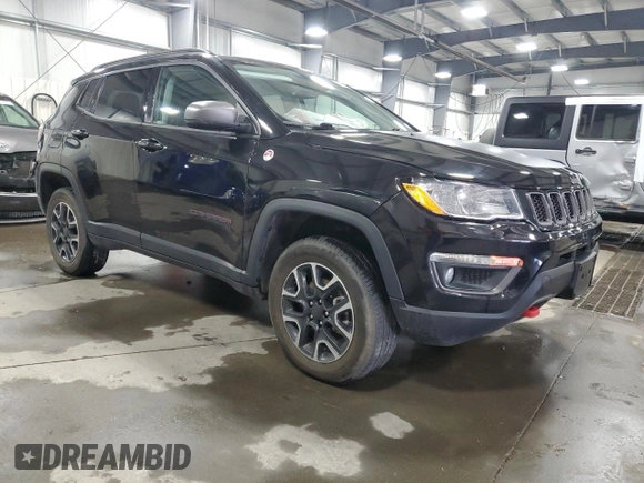 2019 Jeep Compass Trailhawk with VIN 3C4NJDDB4KT647187, listed as a Copart auction lot 50260575 with 63,098 mi miles and Salvage Title. Bid and sale history available at carsss.com. Image 4.