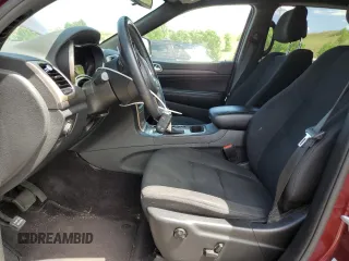 2016 Jeep Grand Cherokee Laredo with VIN 1C4RJFAG8GC413490, listed as a Copart auction lot 62347445 with 104,056 mi miles and Salvage title. Bid and sale history available at DreamBid. Image 7.