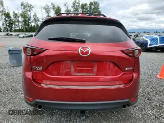 2019 Mazda CX-5 Grand Touring with VIN JM3KFBDM2K0639247, listed as a Copart auction lot 64060045 with 69,563 mi miles and Salvage title. Bid and sale history available at DreamBid. Image 6.