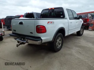 2002 Ford F-150 XLT with VIN 1FTRW08L02KE29411, listed as a IAAI auction lot 42133550 with 270,752 mi miles. Bid and sale history available at carsss.com. Image 4.