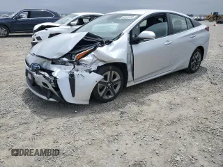 2019 Toyota Prius L Eco z VIN JTDKARFU8K3082646, wystawiony jako Copart lot #58445455 z przebiegiem 52 913 mil mil oraz Szkoda całkowita • Salvage title. Historia ofert i sprzedaży dostępna na DreamBid. Obrazek 1.