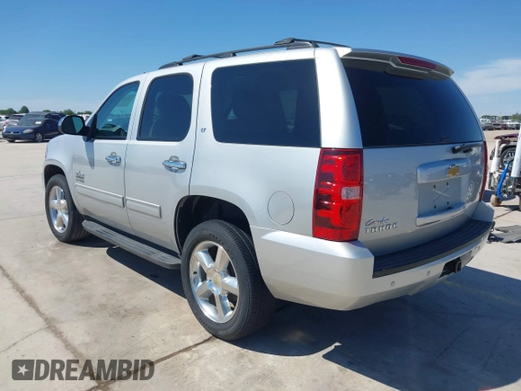 2013 Chevrolet Tahoe LT with VIN 1GNSCBE07DR164486, listed as a IAAI auction lot 42216421 with 220,395 mi miles and . Bid and sale history available at DreamBid. Image 3.