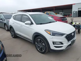 2019 Hyundai Tucson SEL with VIN KM8J33AL2KU985401, listed as a IAAI auction lot 41610465 with 137,943 mi miles. Bid and sale history available at carsss.com. Image 1.